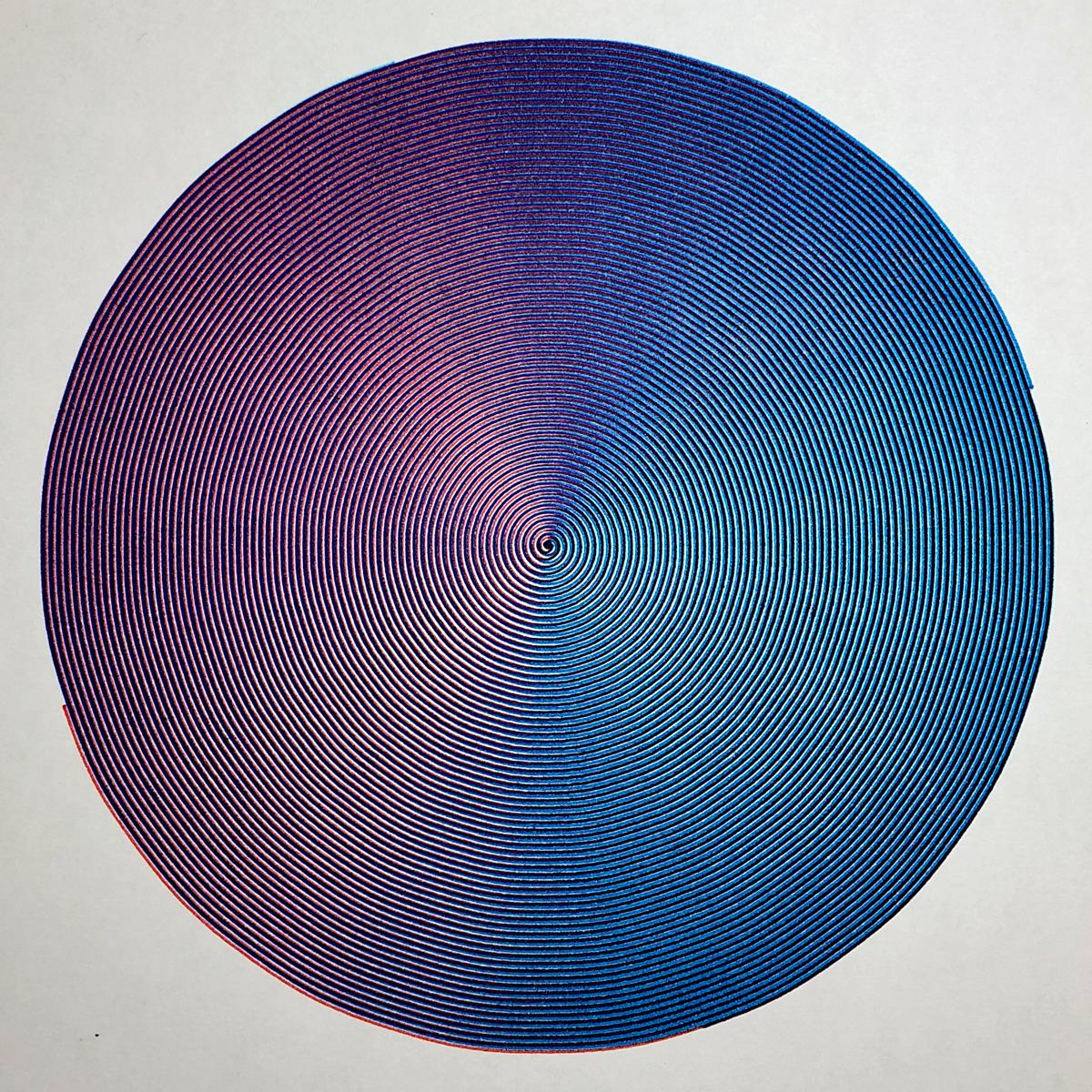 A circular shape made of four tightly-wound coloured spirals. The overall colour is a purple to blue gradient from left to right
