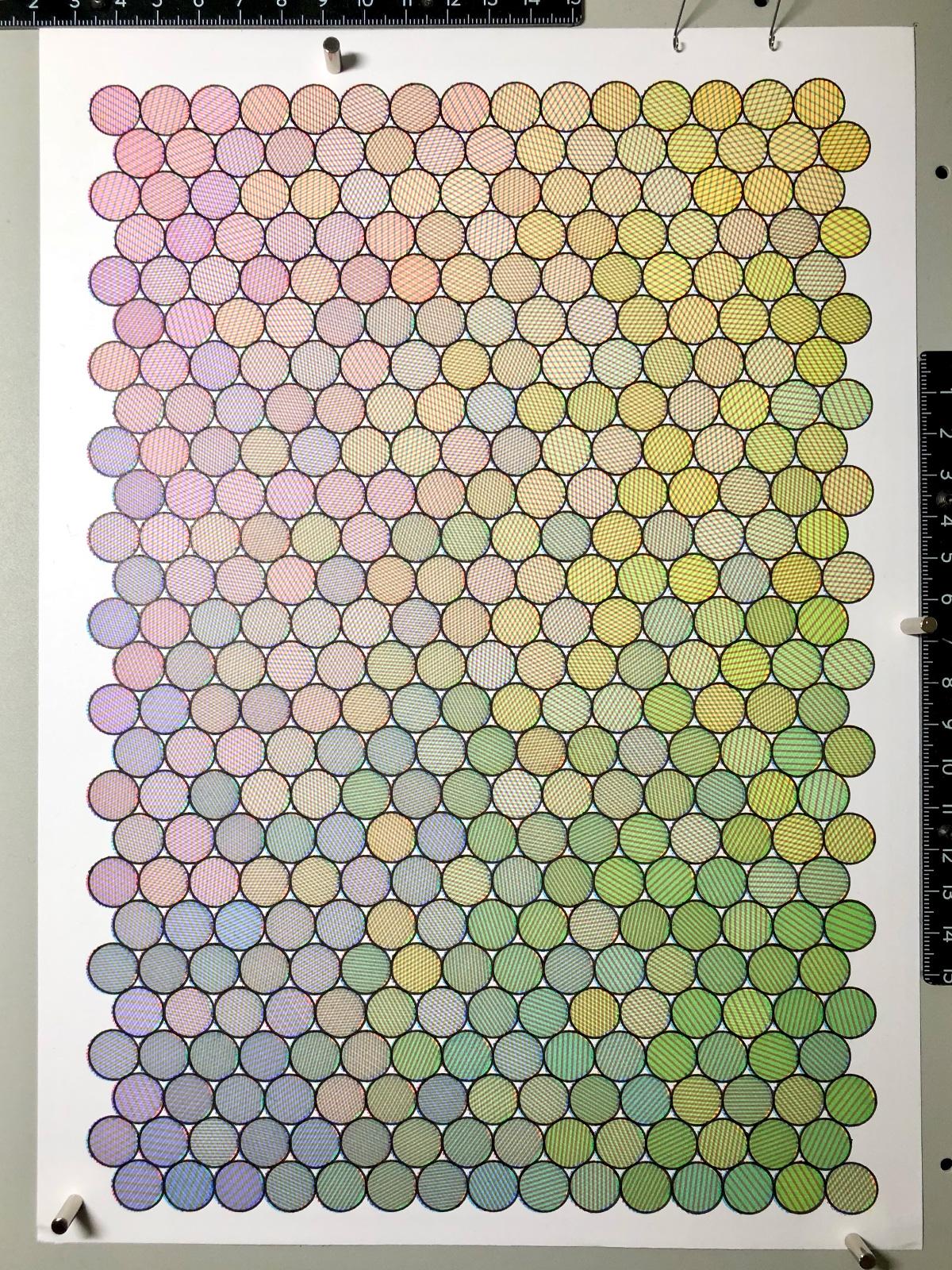 An overview of the piece. Circles are packed into a 15x26 grid, each appearing a slightly different colour based on the coloured lines within